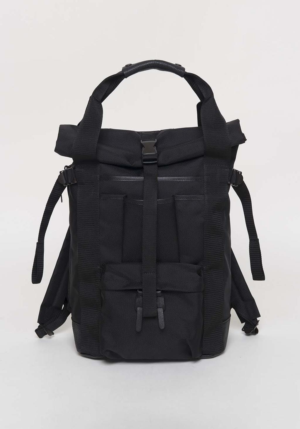 A black textile backpack with a flap closure and patch pockets