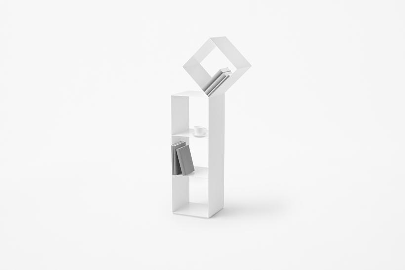 White shelving unit with an angled upper section in a diamond shape