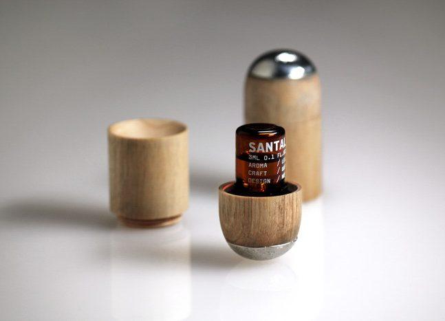 Wooden capsule-shaped bottle with an open Santal aromatic oil