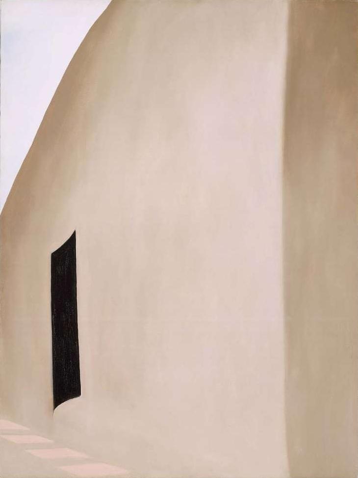 O'Keeffe painting: an adobe wall with a black doorway
