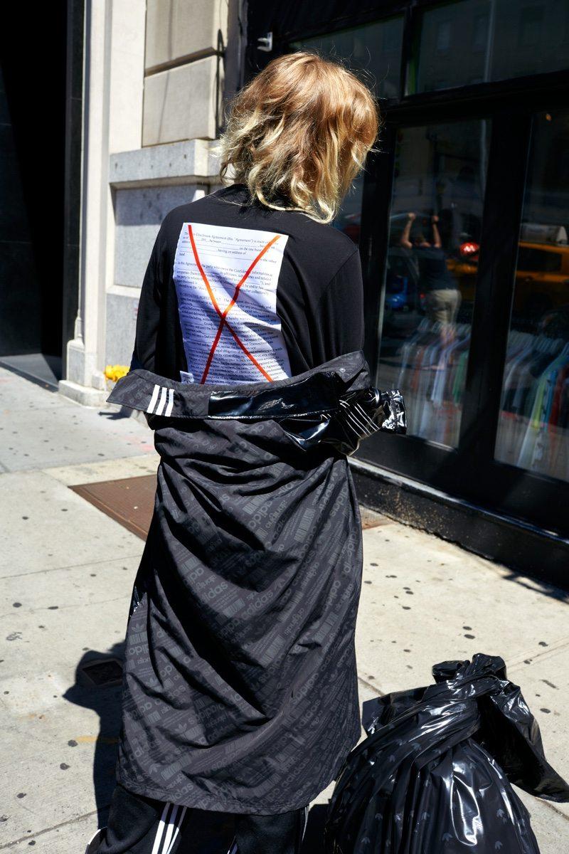 Black long-sleeve top with print and adidas shorts from the Alexander Wang collaboration