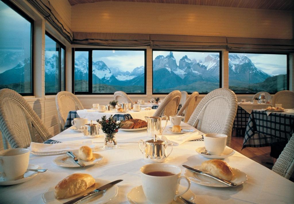 A served breakfast in the hotel restaurant with a panorama of Patagonia's snow-capped mountains