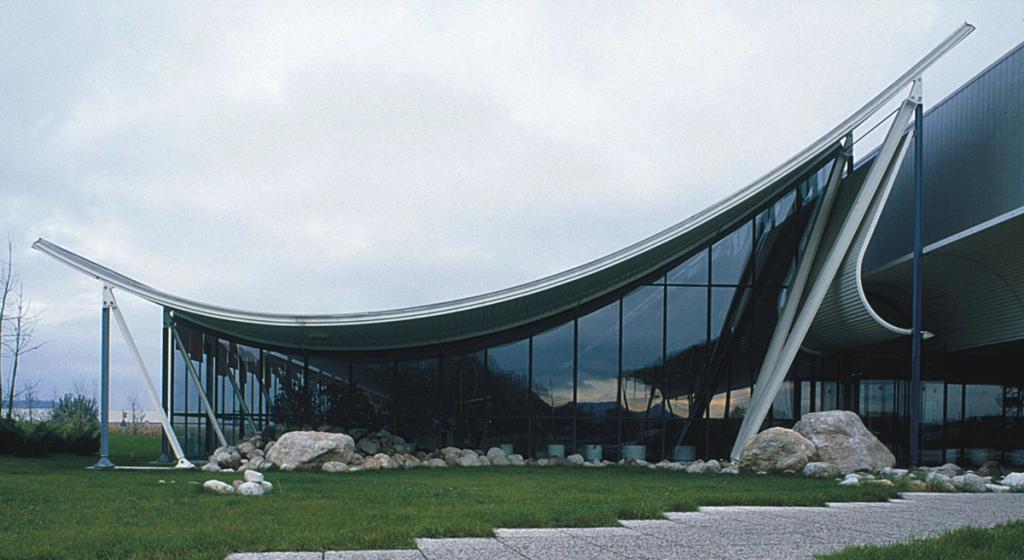 A contemporary building with projecting horizontal floor plates and glazed storeys