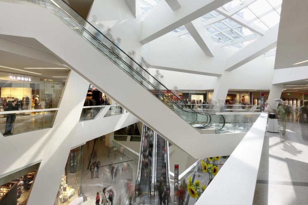 The bright interior of Westside, with escalators and sloping glazed canopies