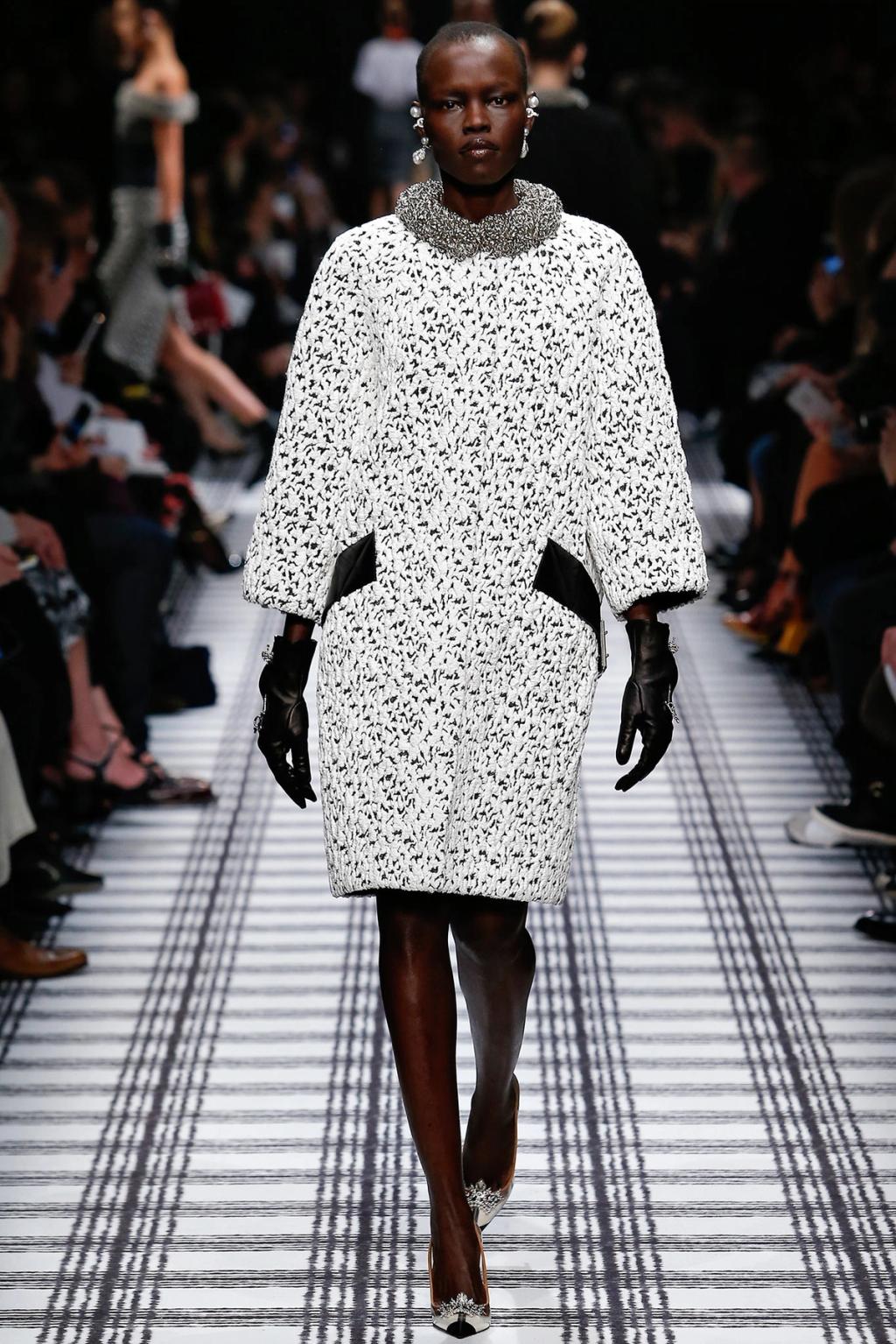 A black-and-white voluminous Balenciaga coat with a silver collar at the show