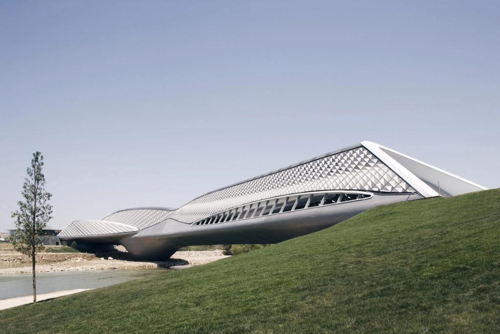 The bridge-pavilion in Zaragoza by Zaha Hadid, with its scaled cladding spanning the River Ebro