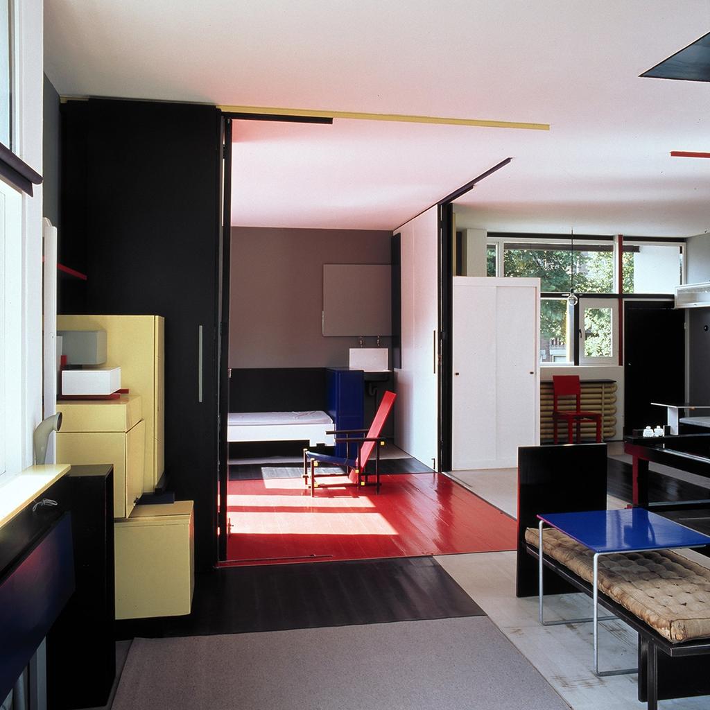 Interior of the Schröder House in the De Stijl style, with a Red and Blue chair and a red floor