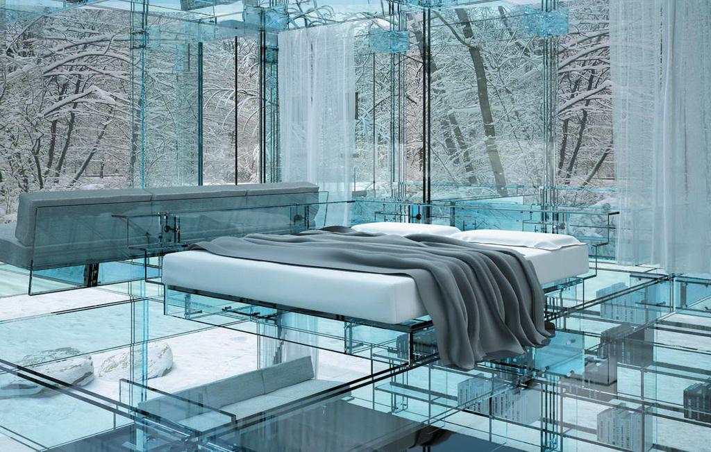 A bedroom with a glass bed and grey bedspread against a backdrop of a winter forest