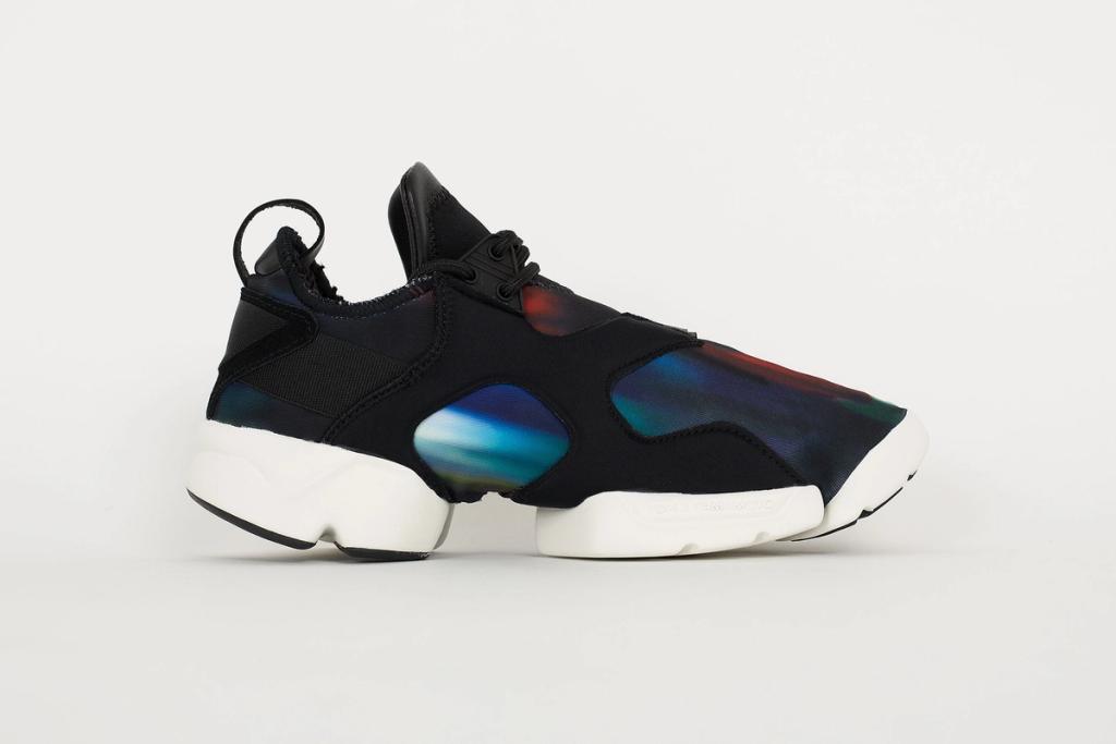 Black Y-3 trainers with web-style lacing and a white Boost sole