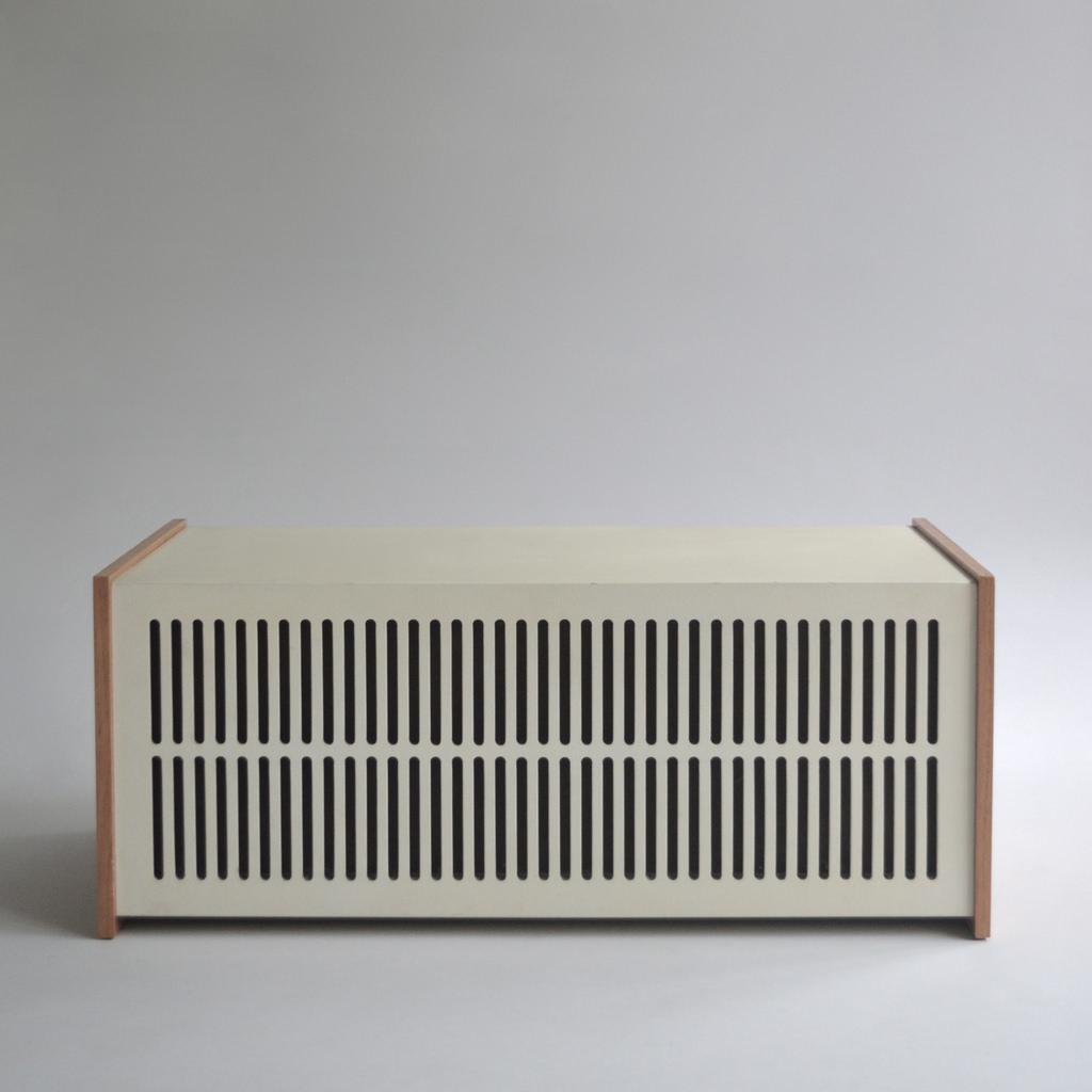 Braun L1 floor-standing speaker in a wooden cabinet with a circular grille driver on metal legs
