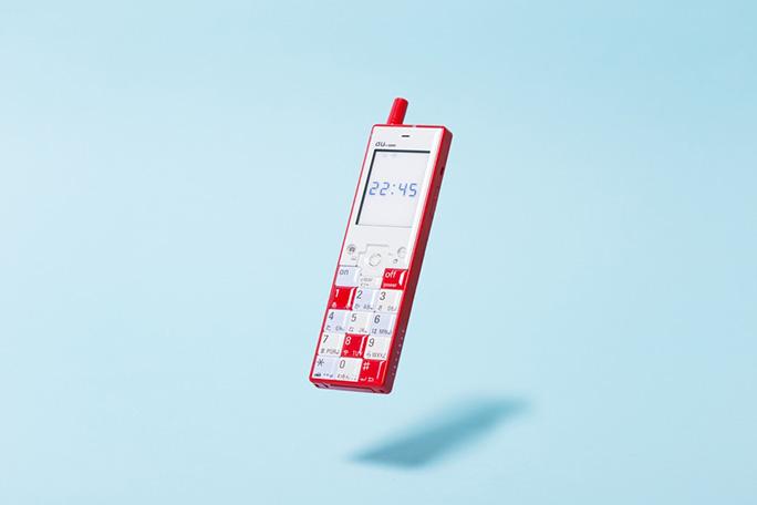 Infobar phone concept in a red-and-white tile pattern against a blue background