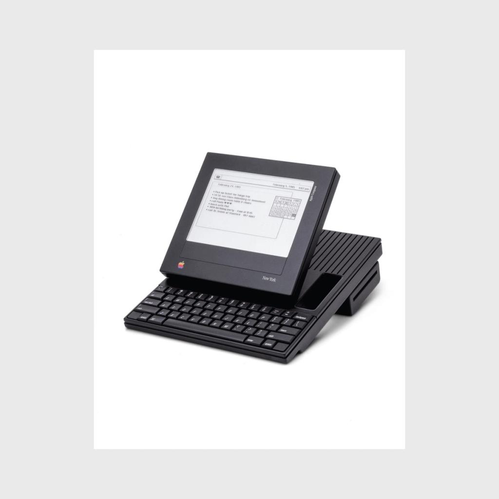 Black concept design of a portable Apple computer with a flip screen and keyboard