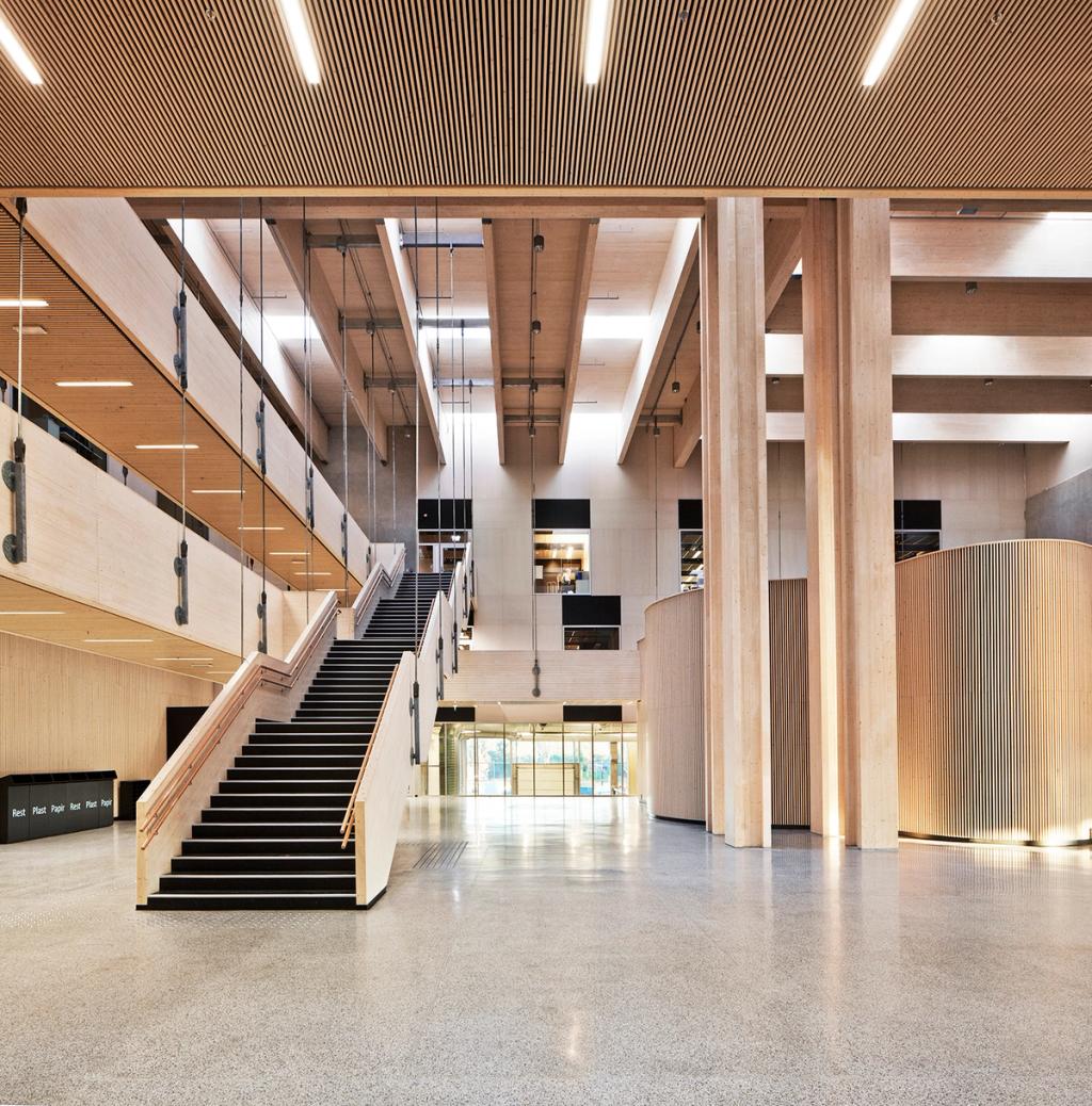 The wooden atrium of Nord-Osterdal school with an open staircase and columns