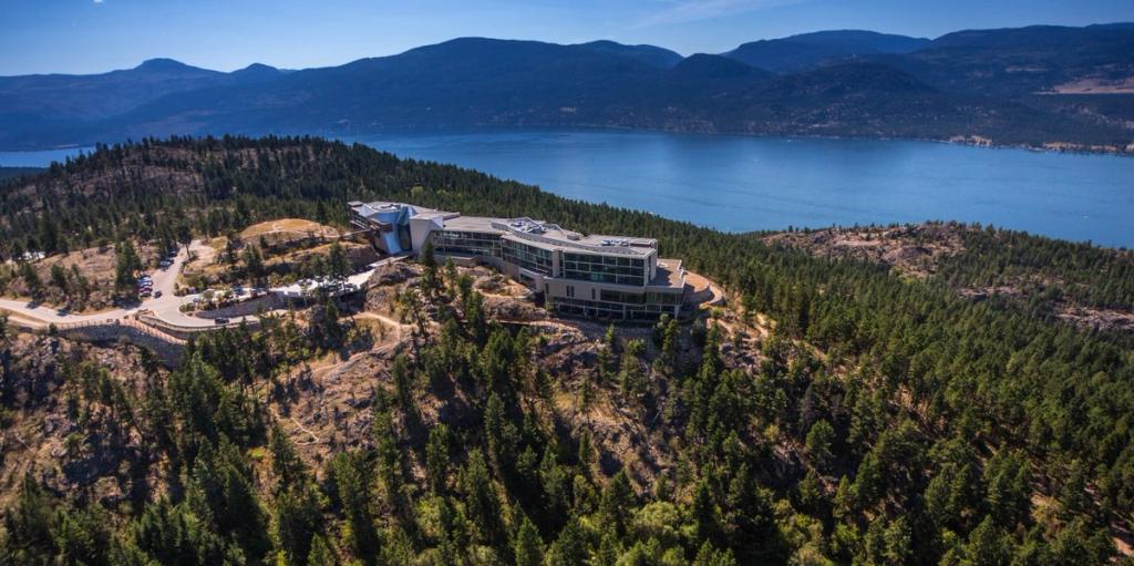 Sparkling Hill Resort on a wooded hill above Okanagan Lake, seen from above