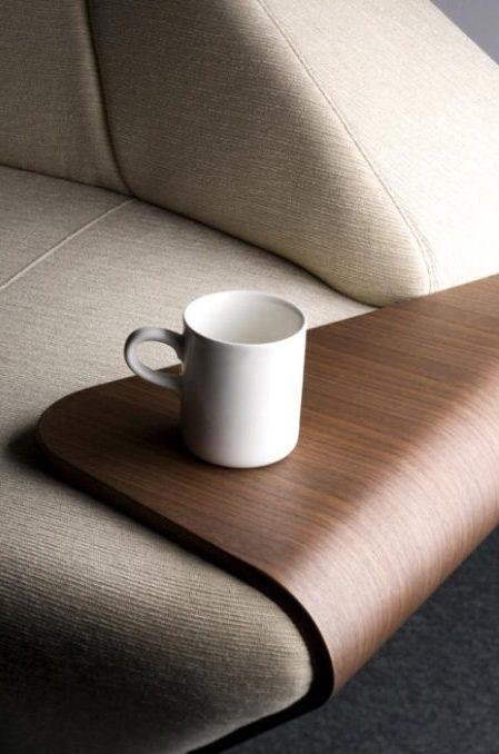 White mug on a wooden armrest shelf of a sofa, designed by Eisuke Tachikawa