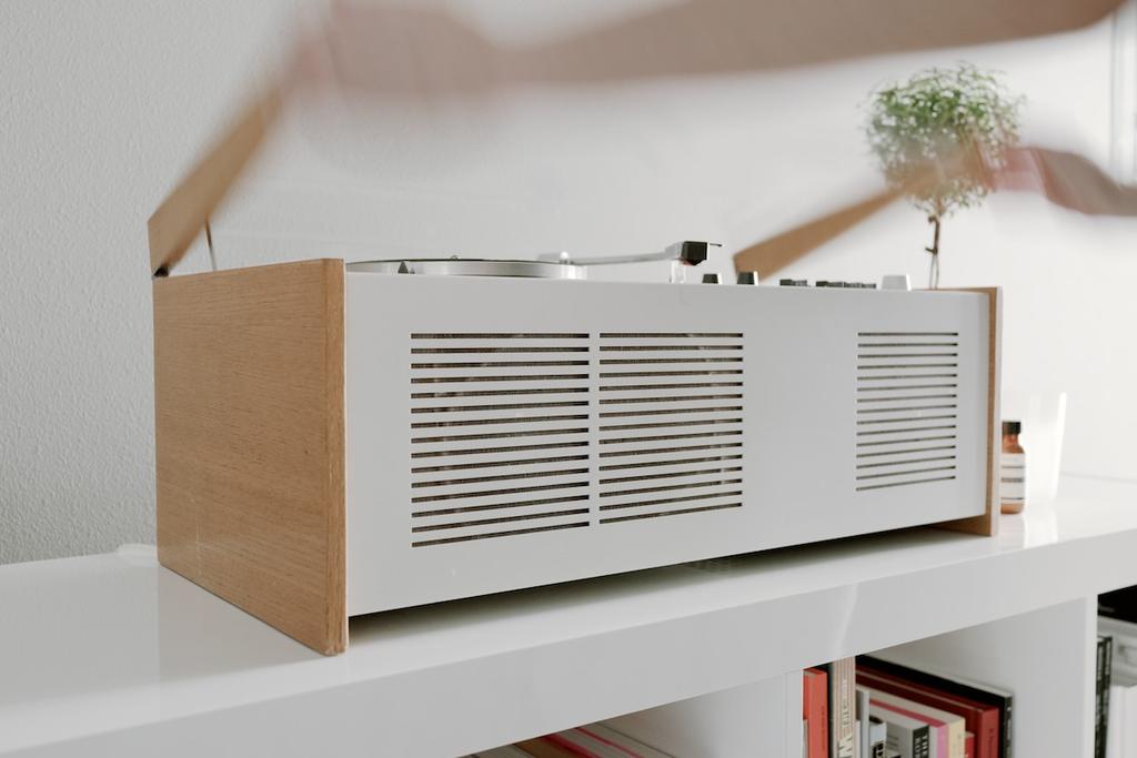 The Braun SK55 record player at three-quarter angle, with its white body and speaker grille