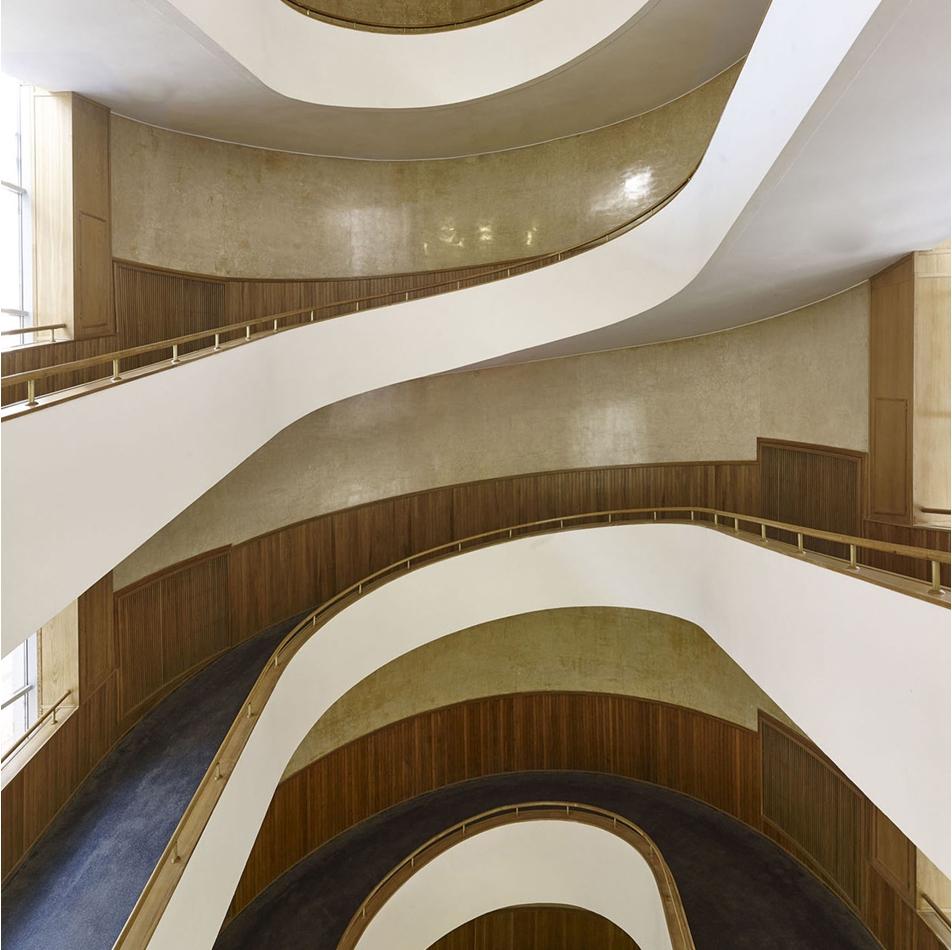 Interior of the Tsentrosoyuz, curving white ramps between floors