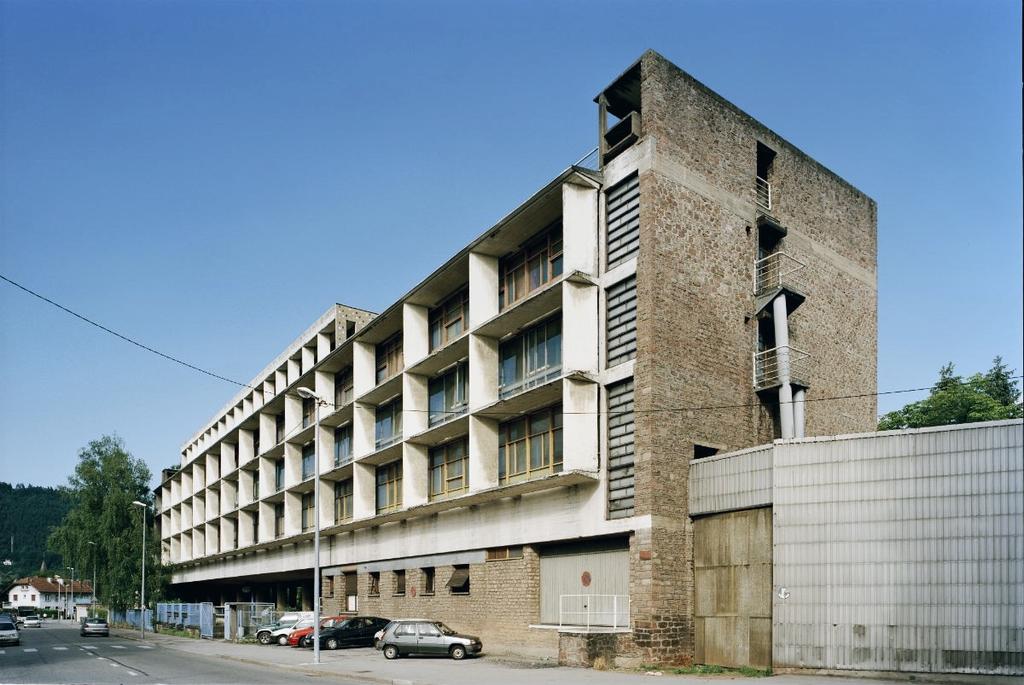 The Unité d'Habitation in Marseille, a concrete façade with loggias and a brick end wall