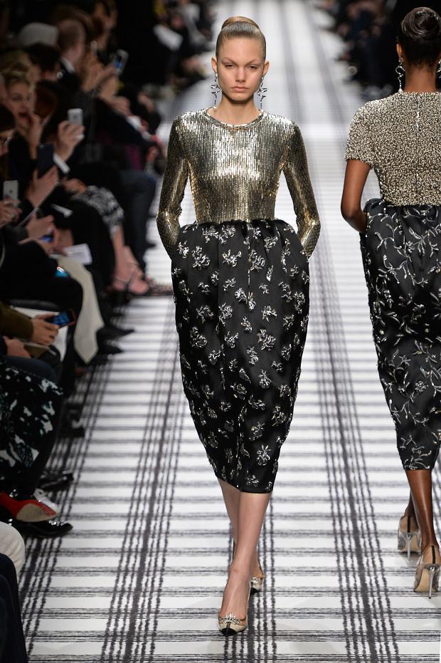 A gold top and black skirt with floral embroidery at the Balenciaga show