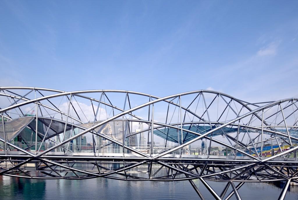 The Helix Bridge in Singapore: a steel structure in the form of a double helix against the sky