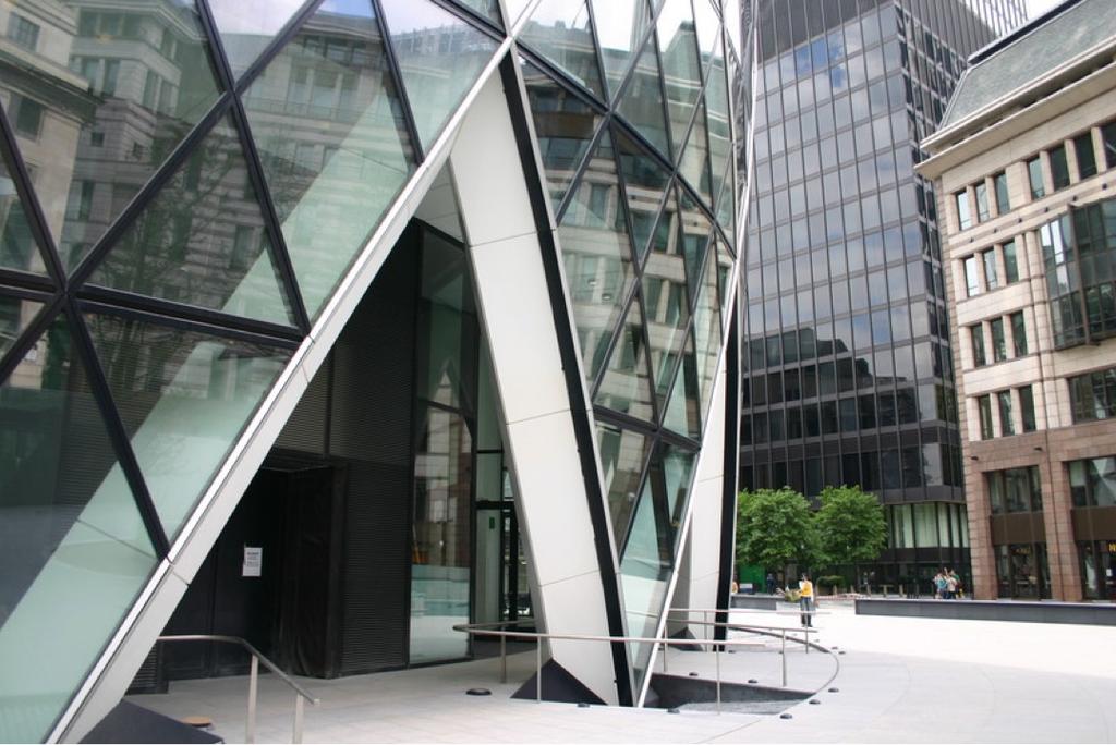 The diagonal inclined columns at the entrance to 30 St Mary Axe on a paved plaza