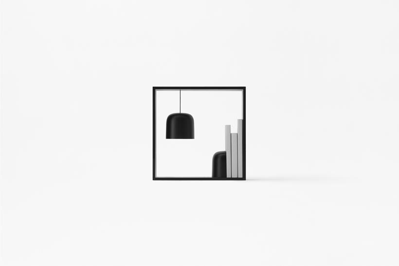 Black square frame with a pendant light, books and a vase