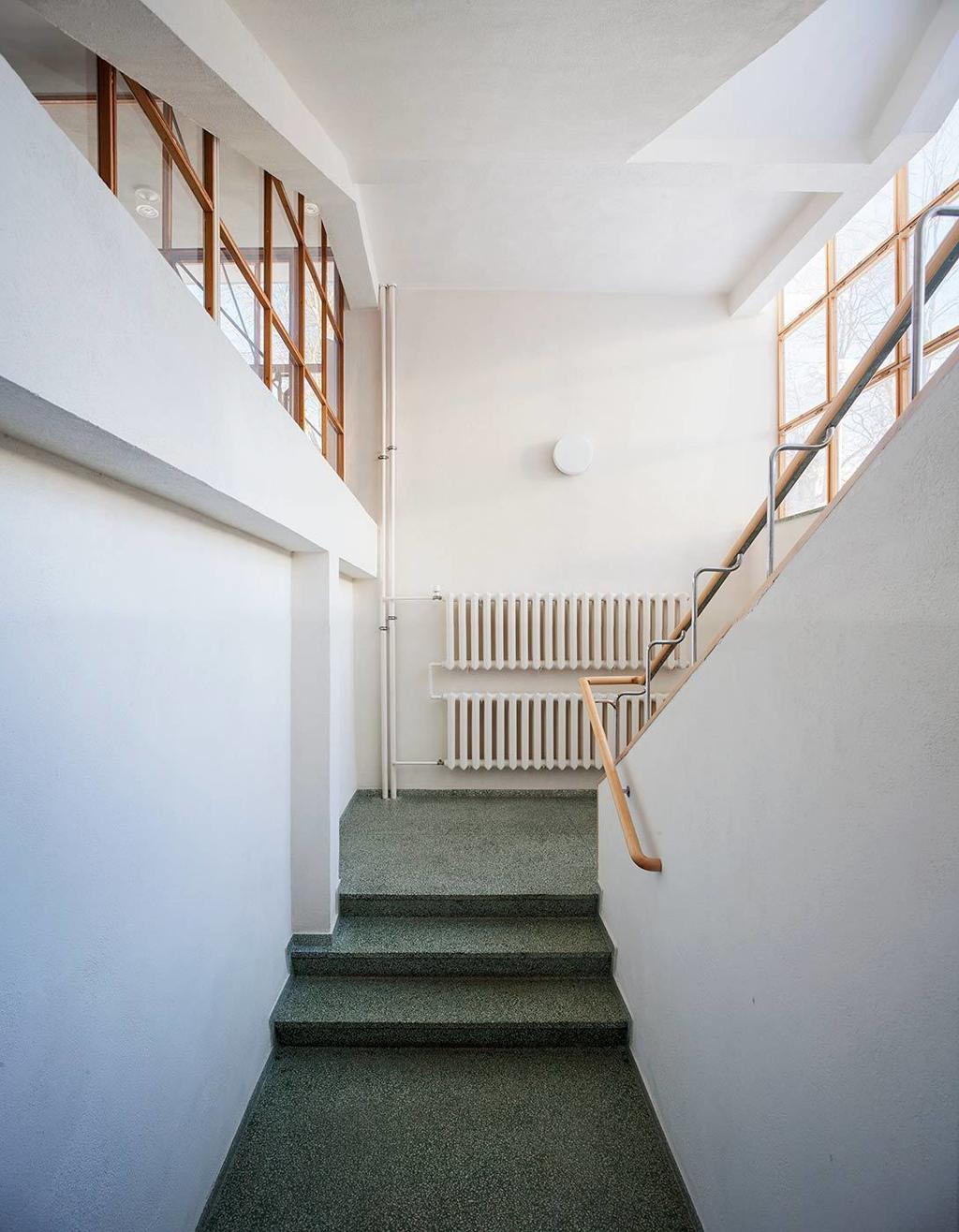 The staircase hall of the Viipuri Library with terrazzo steps, a radiator and clerestory windows