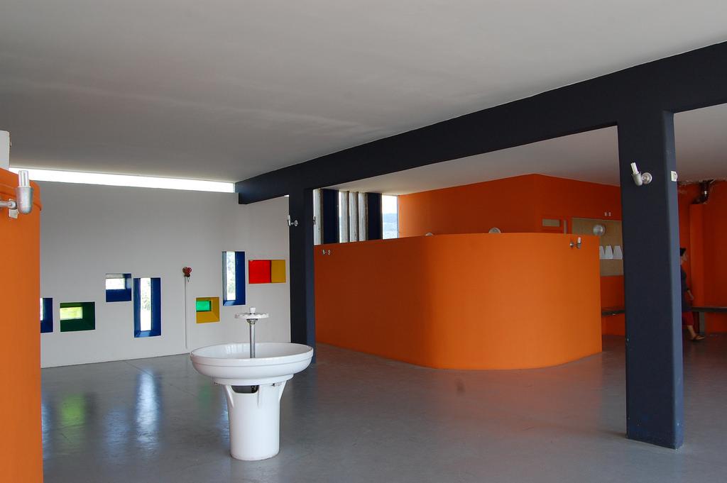 The rooftop nursery of the Unité d'Habitation, with orange volumes and coloured stained-glass windows