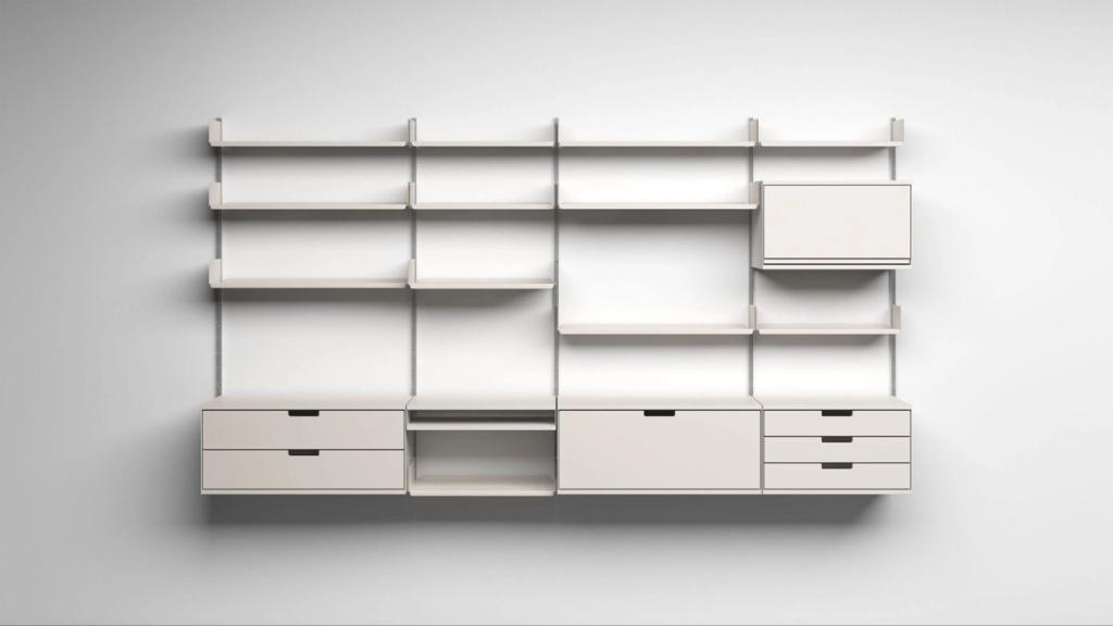 Vitsoe 606 wall-mounted shelving system in white with shelves, drawers and a drop-down door