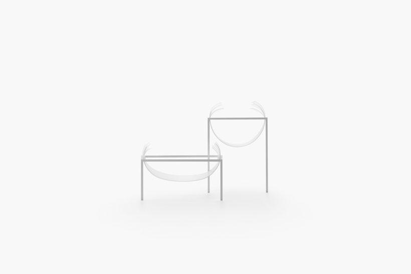 Two white plant stands with drooping fabric bowls