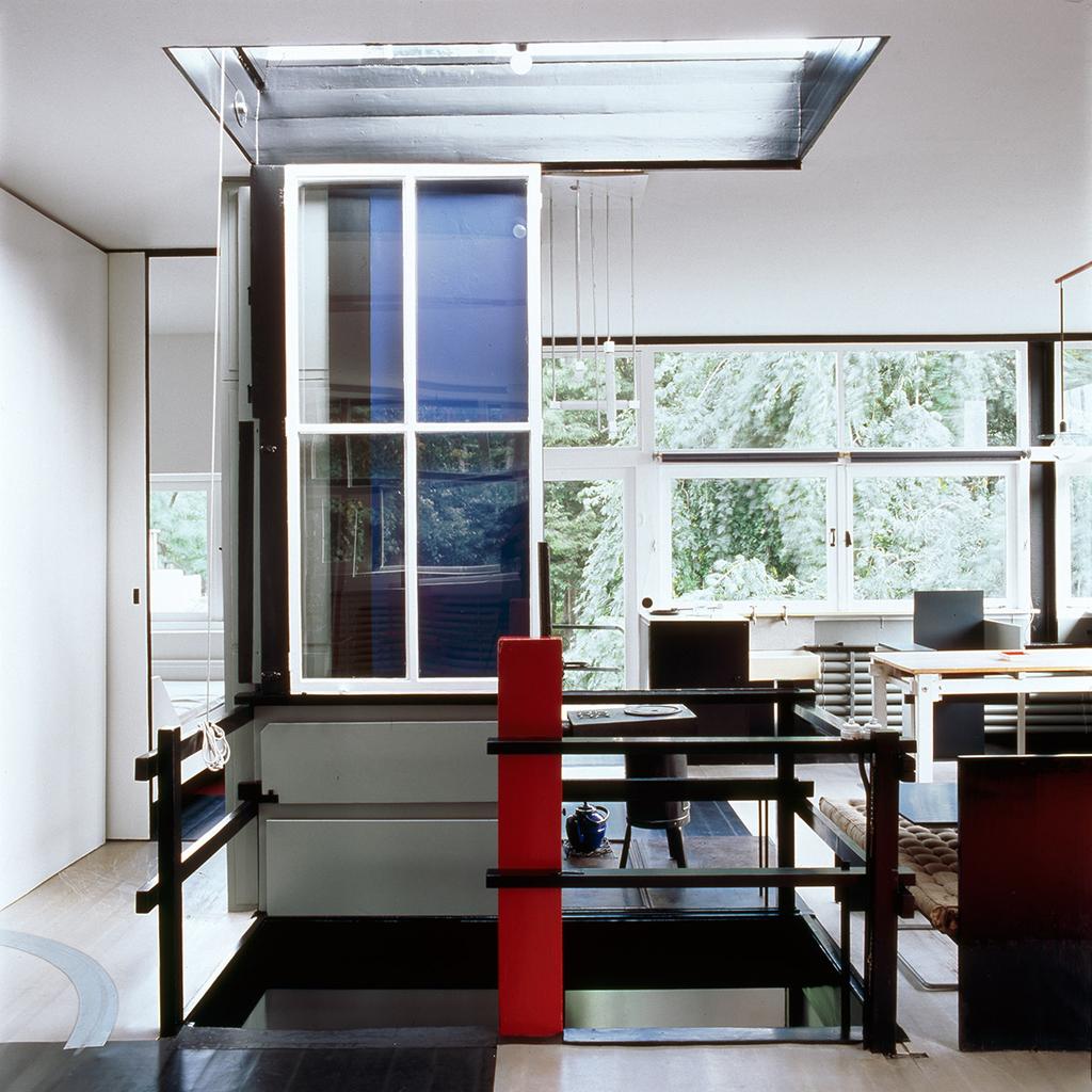 Upper floor of the Schröder House with movable partitions and a red column