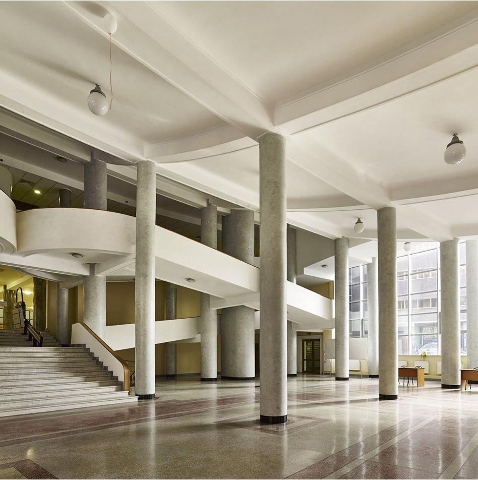 The spacious lobby of the Tsentrosoyuz building, with columns and a wide staircase