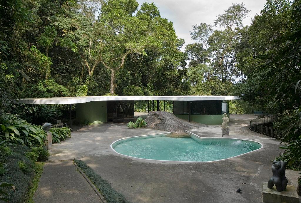 Oscar Niemeyer's Casa Canoas with its undulating roof and free-form pool set among the forest