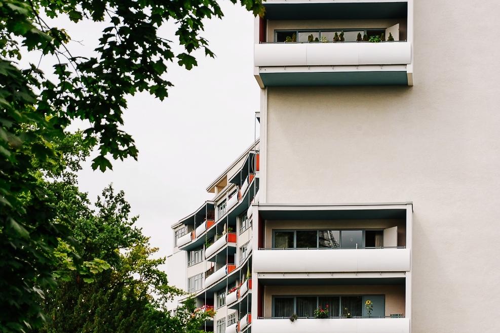 The tall Interbau residential block in Berlin with projecting balconies on a white façade