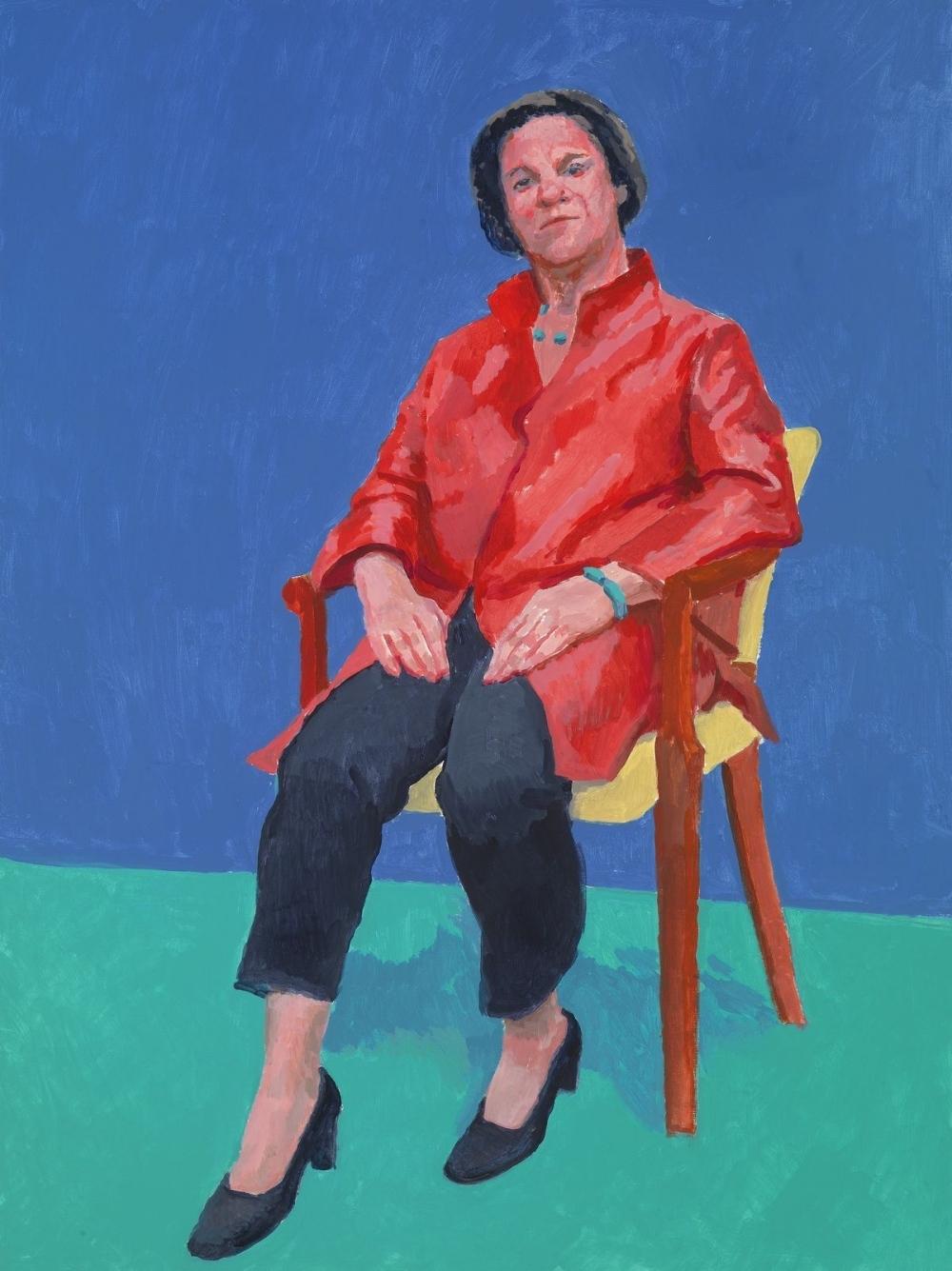 Portrait of a woman in a red shirt seated on a chair, blue and green background