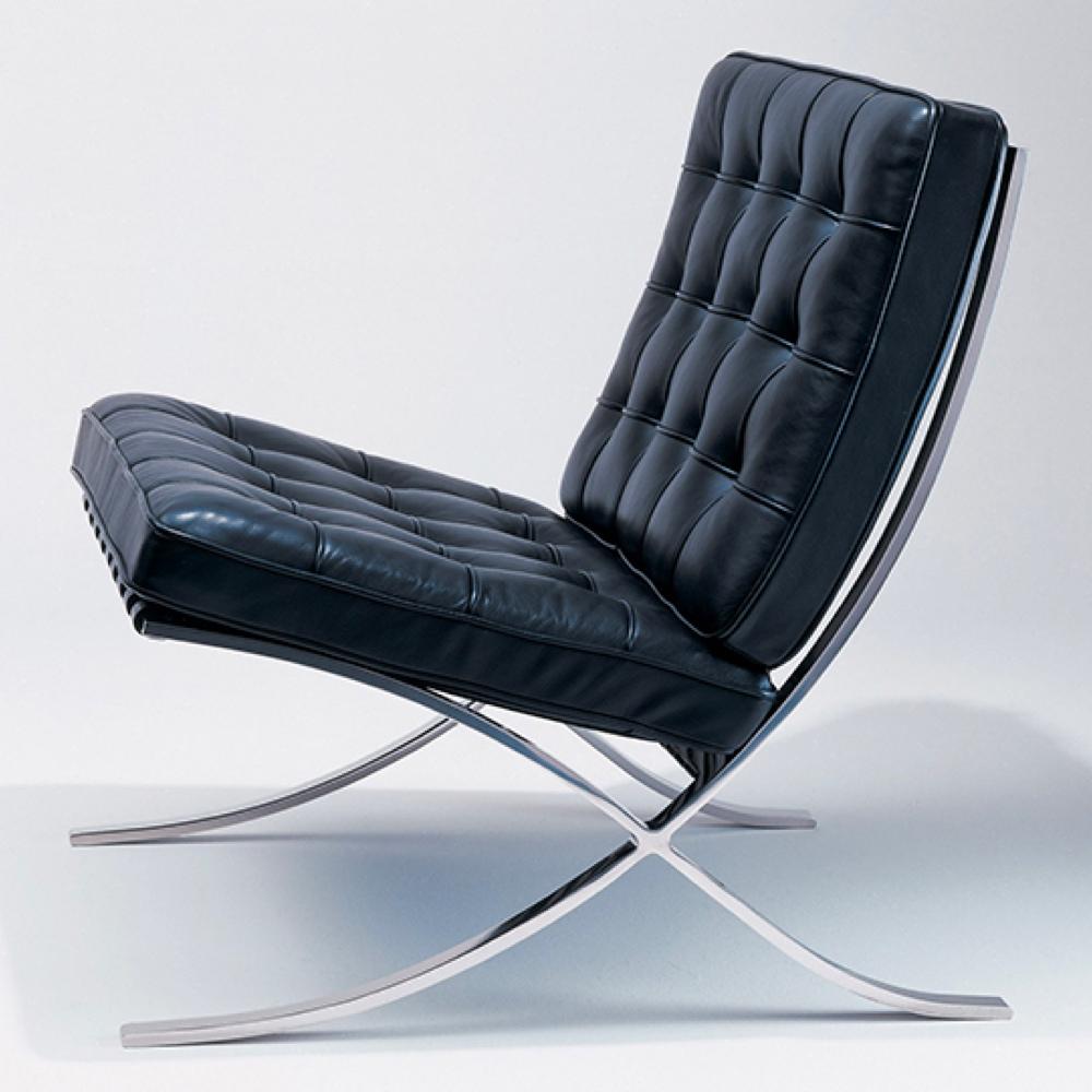 Mies van der Rohe's Barcelona Chair with black quilted leather on a curved steel frame