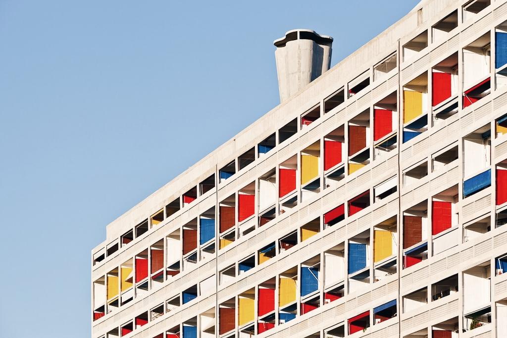 A detail of the façade of the Unité d'Habitation in Marseille, with red, yellow and blue loggias