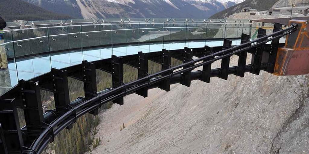 The steel support structure of the Glacier Skywalk's curved glass balcony, cantilevering over the canyon