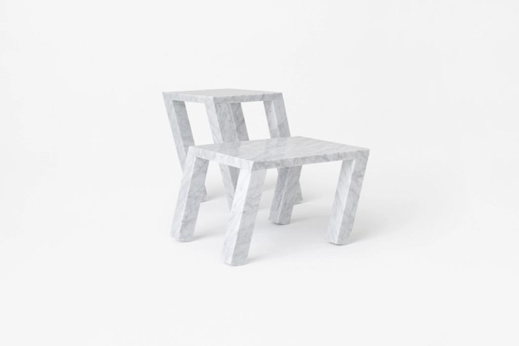 Two marble children's chairs stacked on top of each other