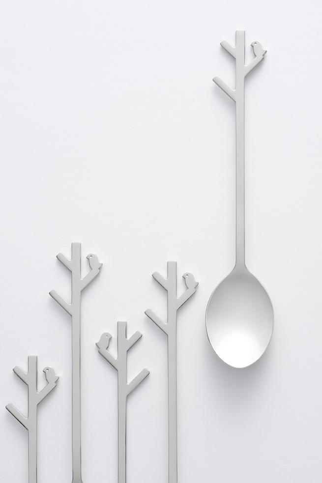 Steel spoons in the shape of trees with birds, designed by Oki Sato