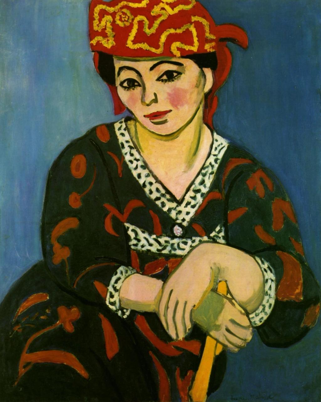 Matisse's portrait Madame Matisse in a Red Madras Headscarf: a woman in a red patterned headscarf against a blue background