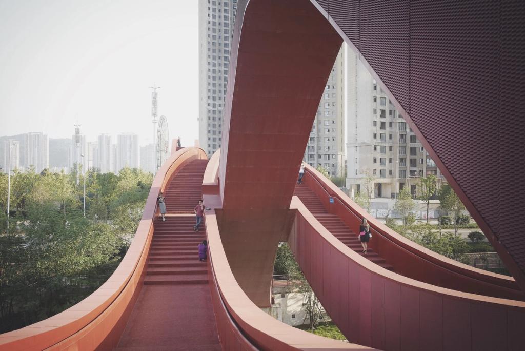 The intertwining red pedestrian pathways of the Lucky Knot Bridge, with people climbing the steps