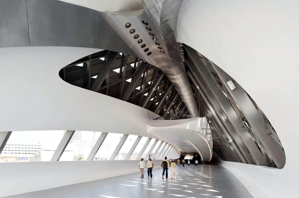 Interior of the Zaragoza bridge-pavilion showing the ribbed steel structure, with visitors walking through
