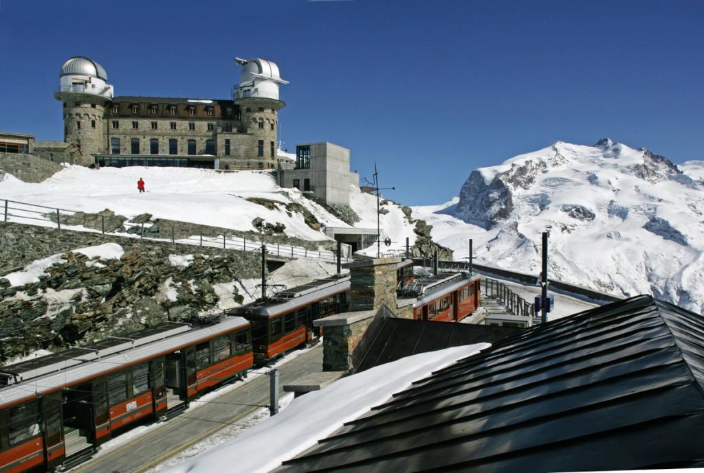 The Gornergrat rack-railway station beside the stone hotel with its observatories