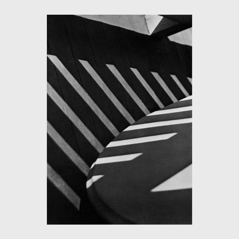 Stieglitz's black-and-white photograph with diagonal bands of light and shadow