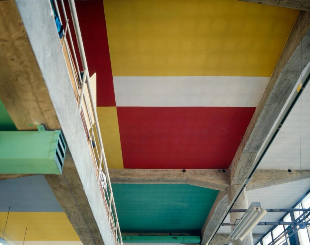 Pilotis of the Unité d'Habitation in Marseille, with a vivid red, yellow and green painted ceiling