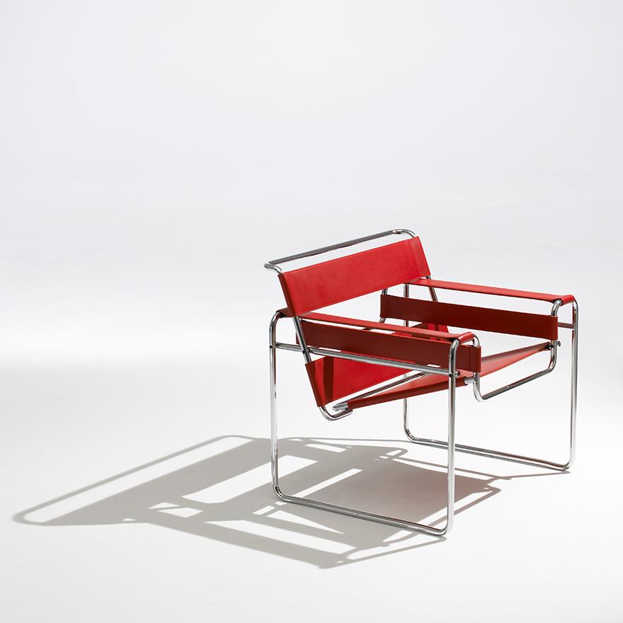 Marcel Breuer's Wassily Chair in chrome-plated tubular steel with red leather straps