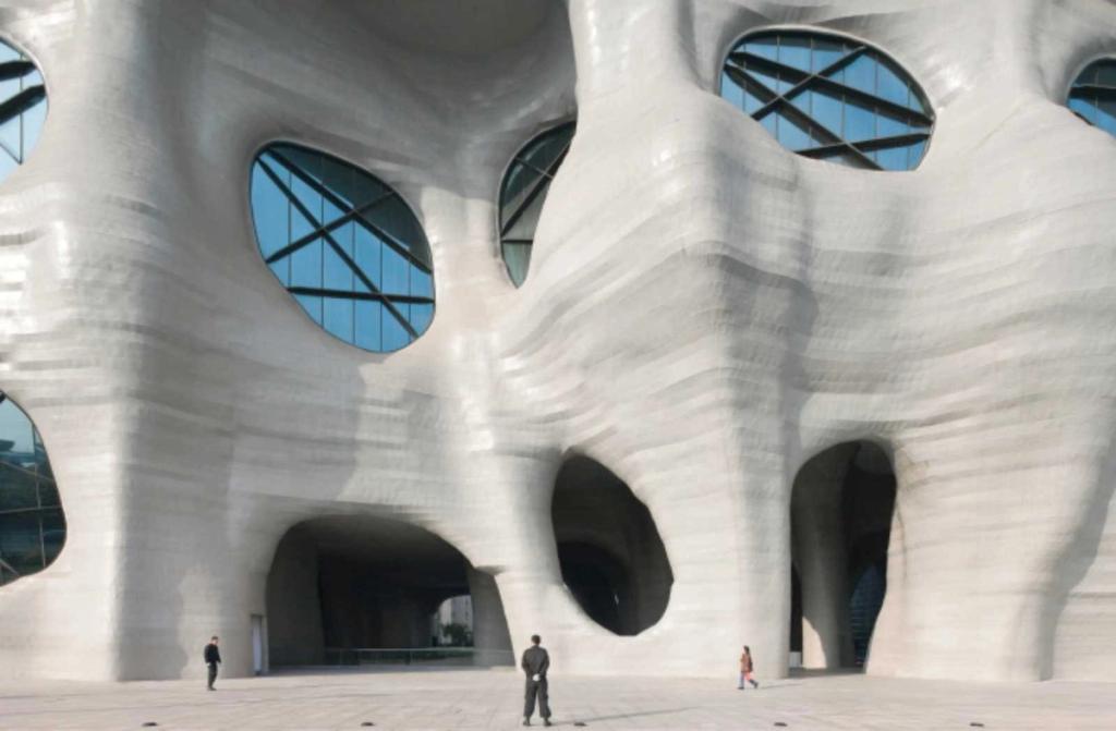 A close-up of the Himalayas Center's sculptural white supports with oval glazed openings