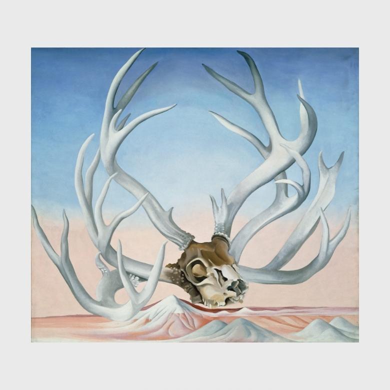 O'Keeffe painting: deer antlers and skull against a pink-blue desert background