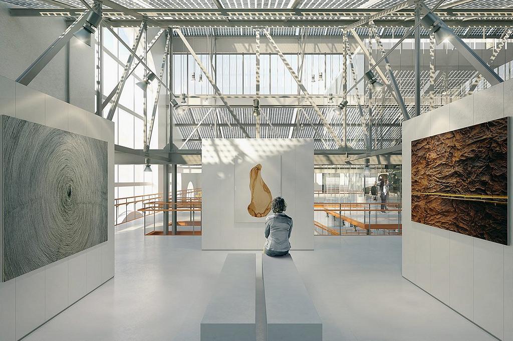 The exhibition space of GES-2, featuring large works on white walls beneath a glass roof